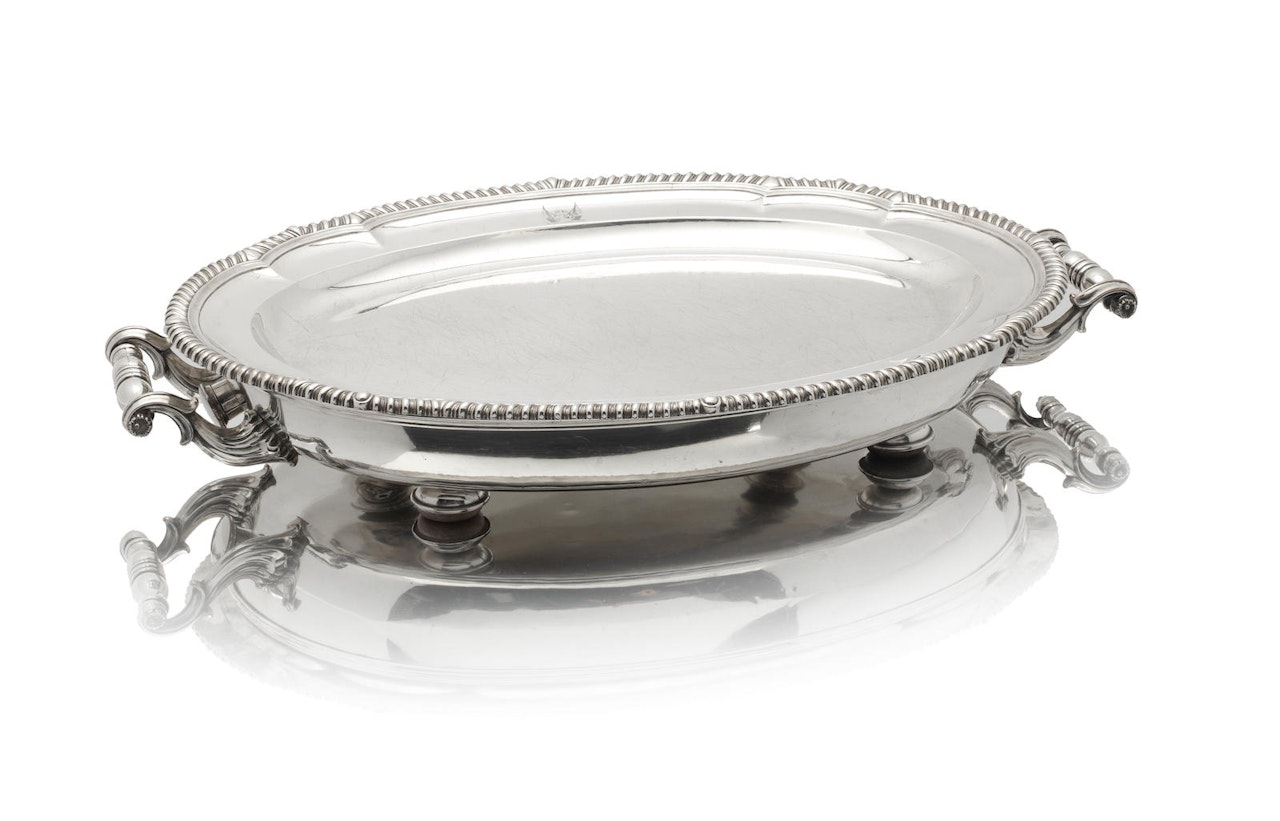 A George III silver meat dish and Old Sheffield Plate warming stand by Anonymous