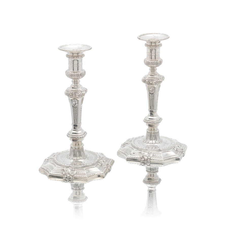 A pair of George III silver candlesticks by Anonymous