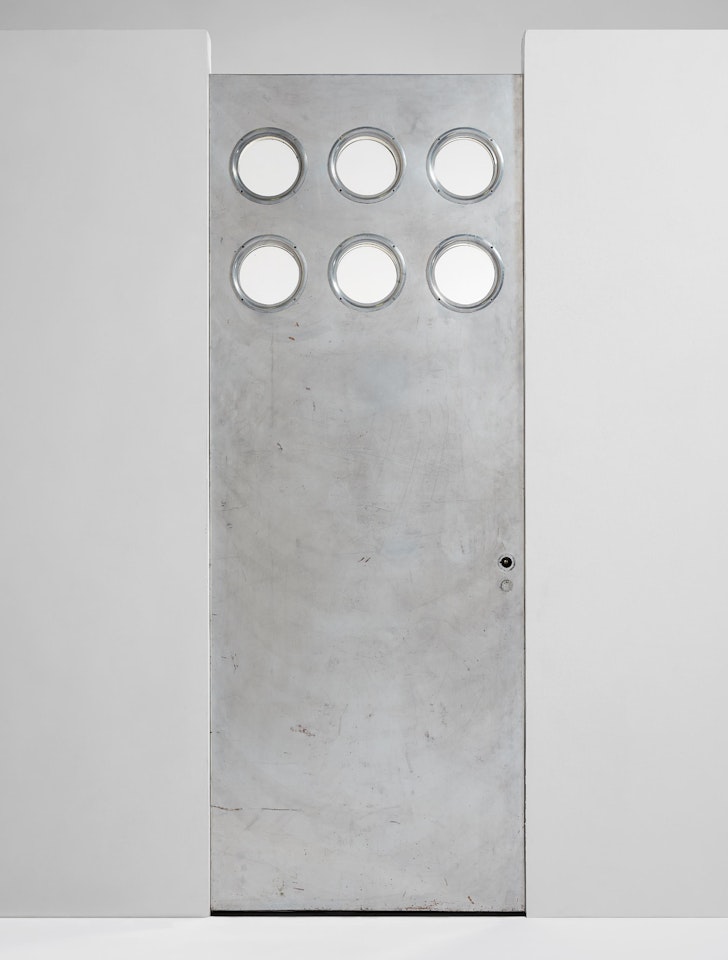 Door with portholes by Jean Prouvé