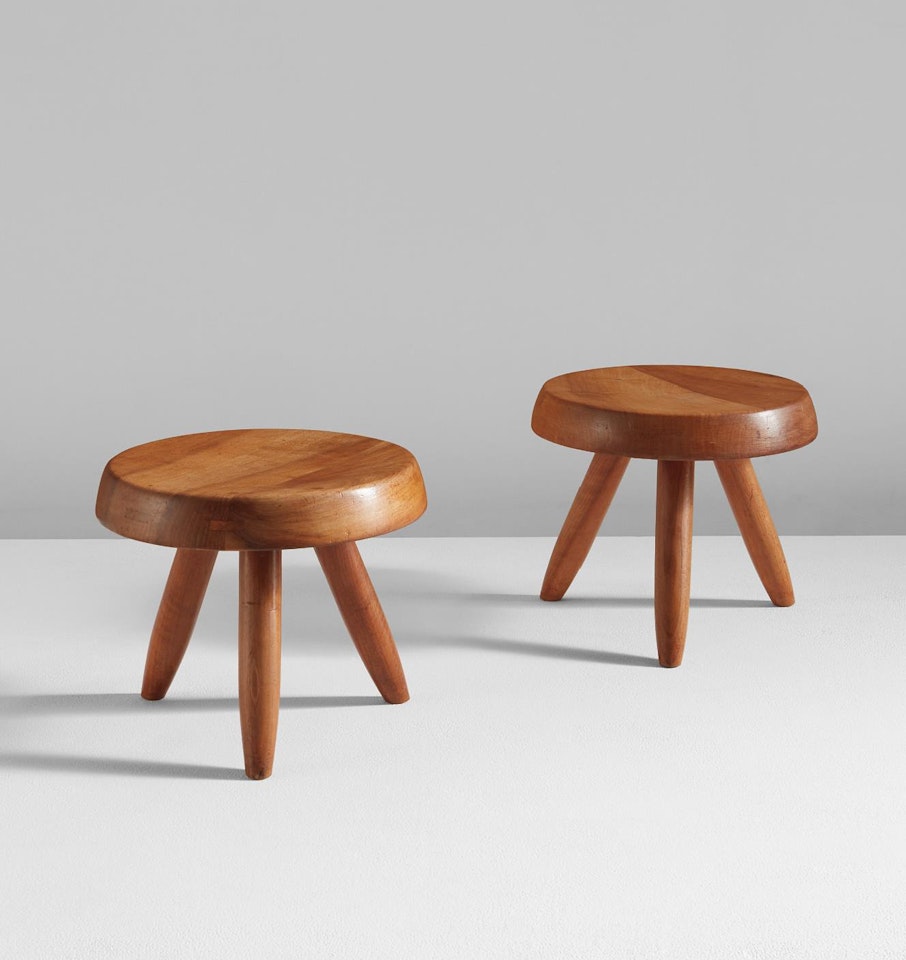 Pair of low tripod stools by Charlotte Perriand