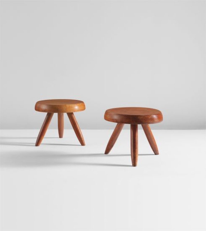 Pair of low tripod stools by Charlotte Perriand