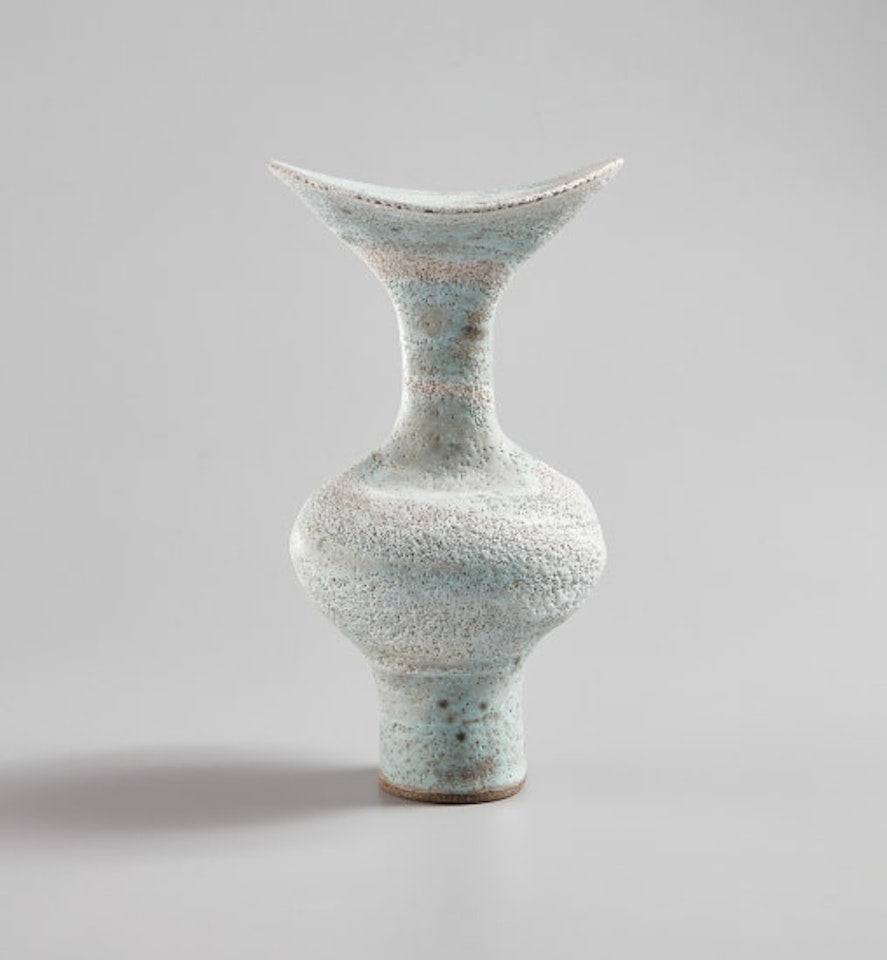Tall vase with flaring lip and integral spiral by Lucie Rie