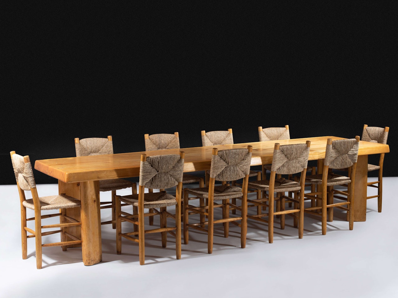 Suite de 10 chaises dites "Bauches" by Charlotte Perriand