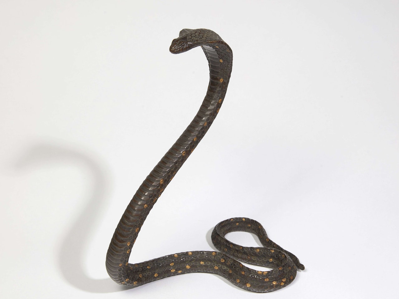 Cobra dressé  by Jean Dunand