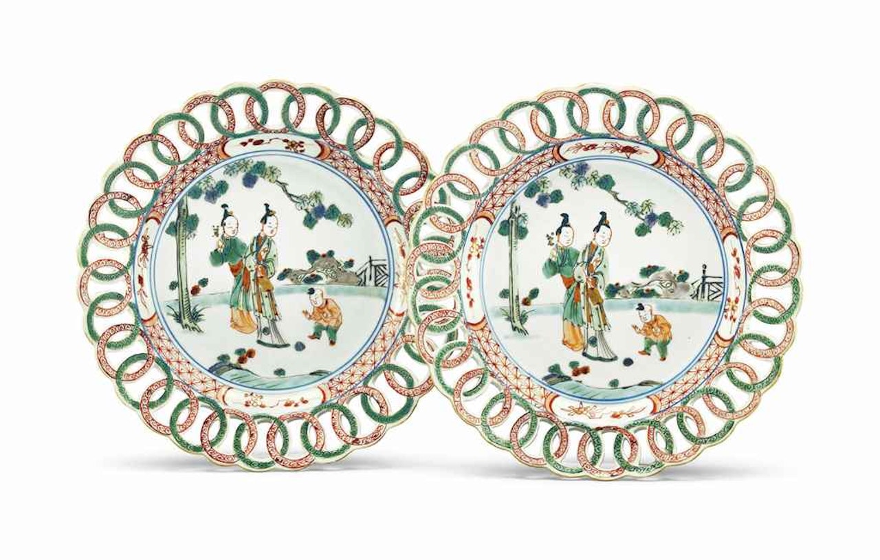 A PAIR OF FAMILLE VERTE RETICULATED PLATES by Anonymous
