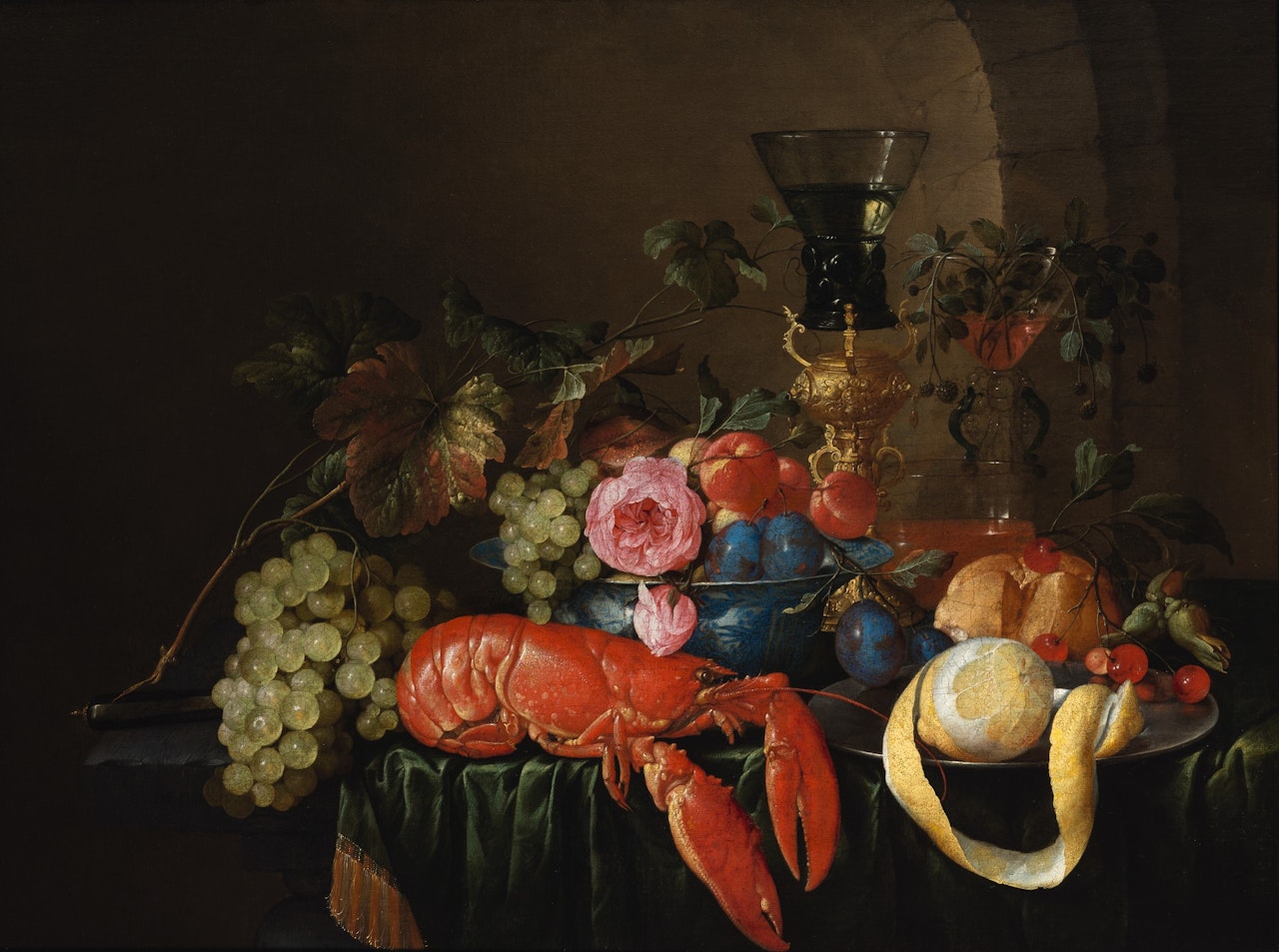 STILL LIFE WITH A LOBSTER, A PEELED LEMON ON A PEWTER PLATTER, A ROEMER, AND FRUITS ON A STONE LEDGE WITH GREEN DRAPE by Cornelis de Heem