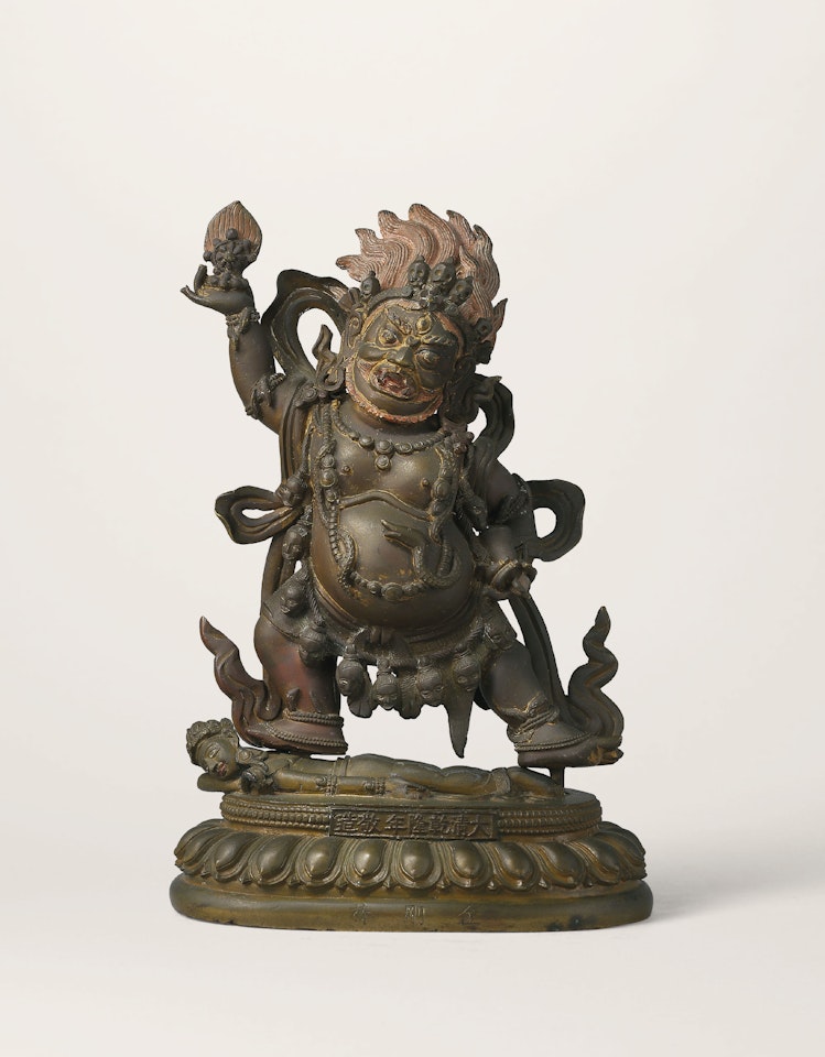 A BRONZE FIGURE OF MOHAYAMARI AND A STAND by Anonymous