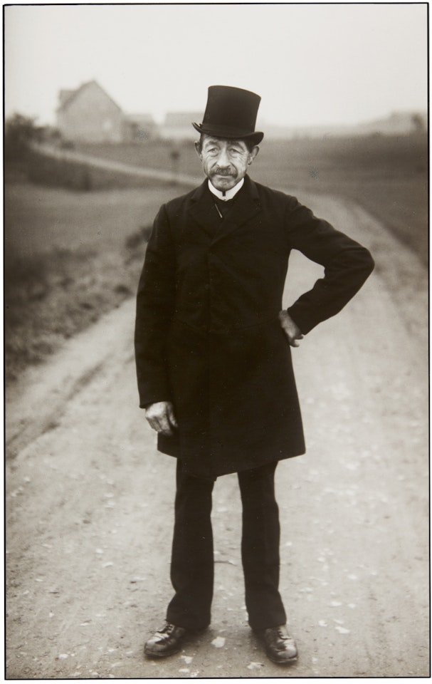 FARMER ON HIS WAY TO CHURCH by August Sander