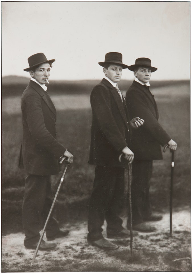 THREE YOUNG FARMERS ON THEIR WAY TO A DANCE, WESTERWALD by August Sander