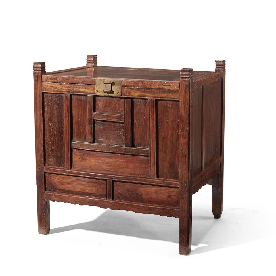 A huanghuali and mixed wood rice chest by Anonymous