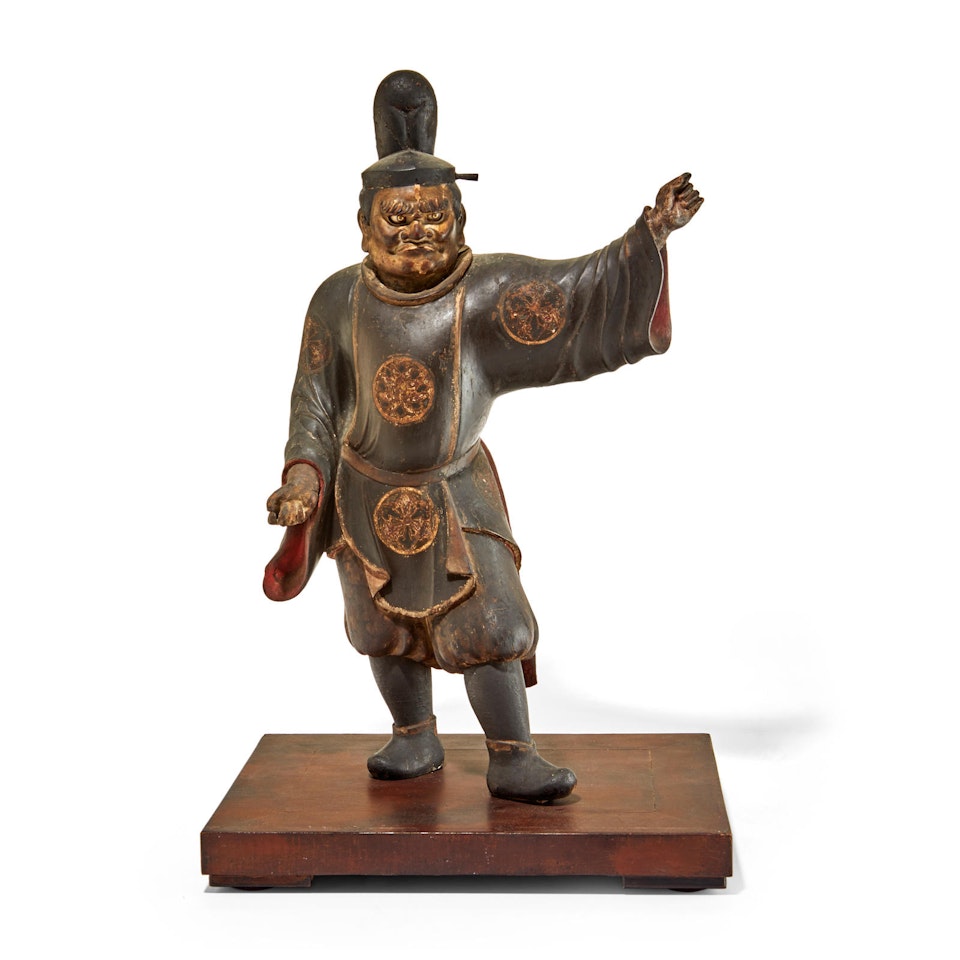 A standing wood figure of a courtier  by Anonymous