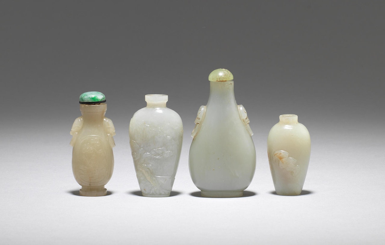 A group of four jade snuff bottles by Anonymous
