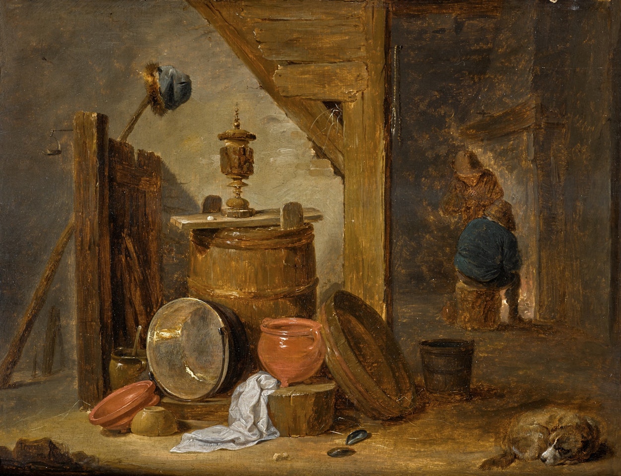A BARN INTERIOR WITH A STILL LIFE OF KITCHEN UTENSILS, A DOG, AND FIGURES BY A FIREPLACE BEYOND by David Teniers II