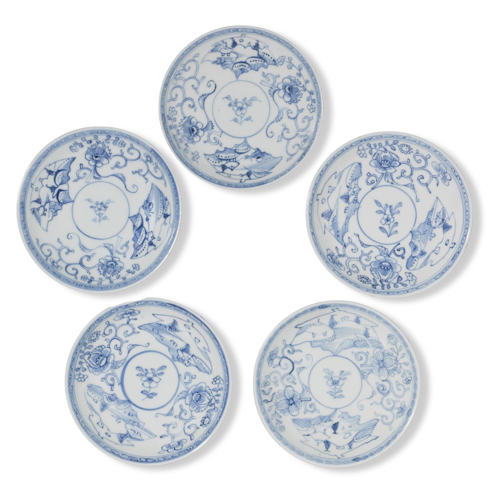 A GROUP OF FIVE BLANK DOUCAI 'LANDSCAPE CARTOUCHE AND PEONY SCROLL' SAUCER DISHES by Anonymous