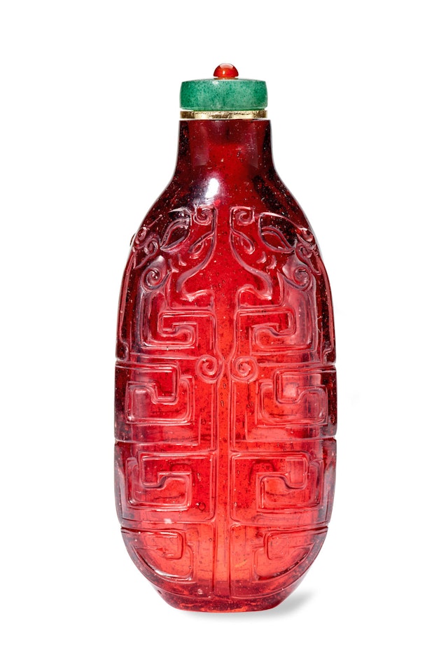 A CARVED RED GLASS SNUFF BOTTLE  by Anonymous