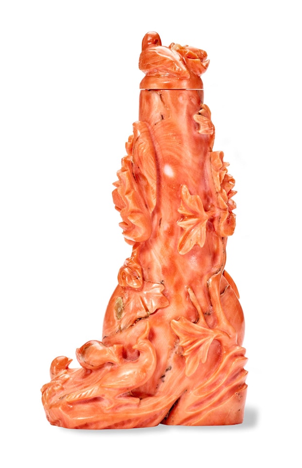 A CARVED CORAL SNUFF BOTTLE by Anonymous