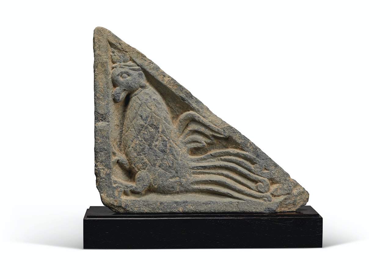 A GRAY SCHIST STAIR-RISER RELIEF OF A MYTHICAL BEAST by Anonymous