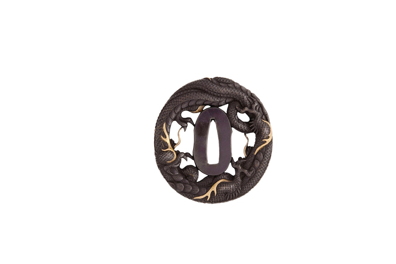A shakudo tsuba by Anonymous