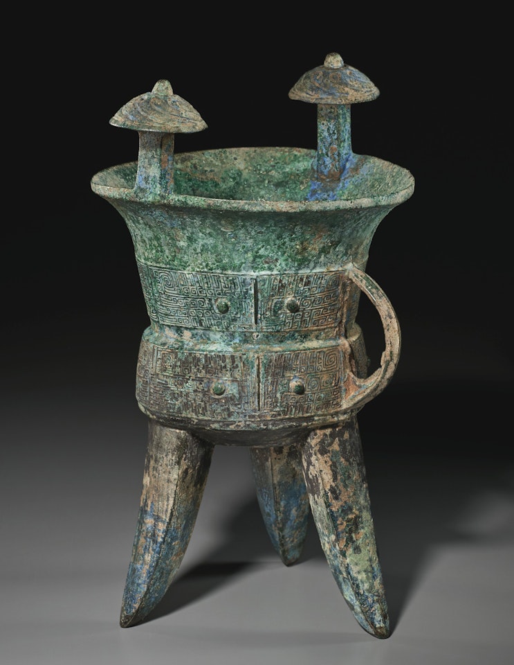 A BRONZE RITUAL TRIPOD WINE VESSEL, JIA by Anonymous