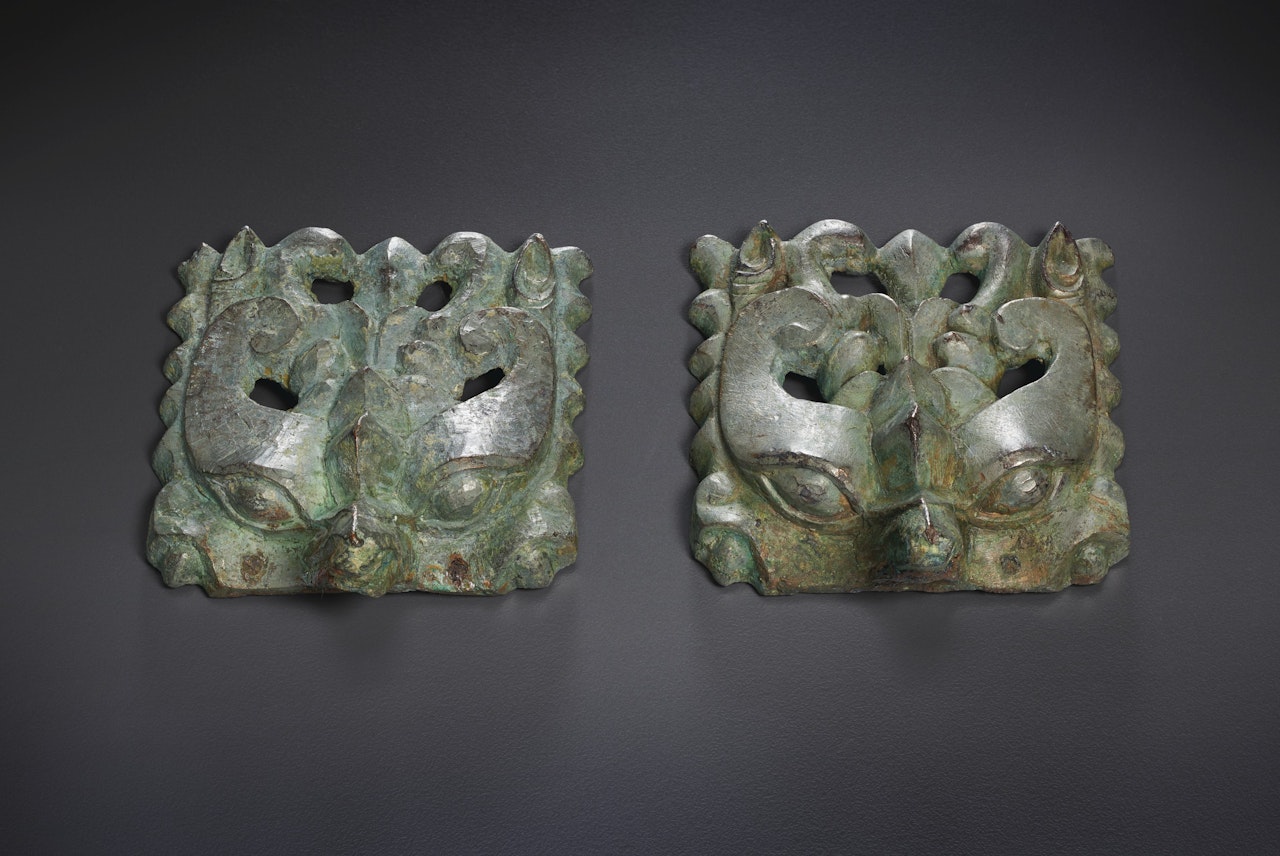 A PAIR OF BRONZE TAOTIE MASKS by Anonymous