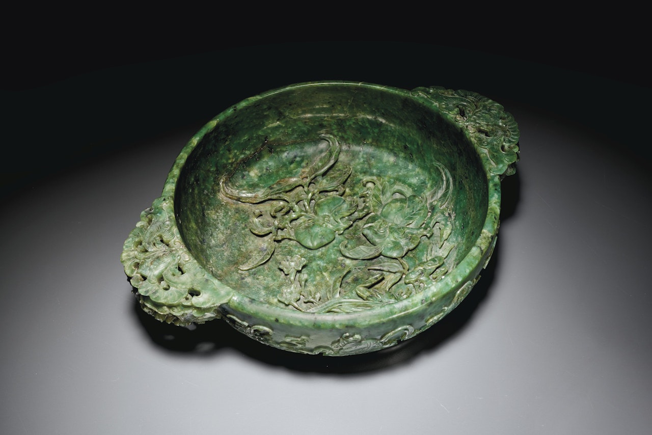 A RARE LARGE AND FINELY CARVED SPINACH-GREEN JADE MARRIAGE BOWL by Anonymous