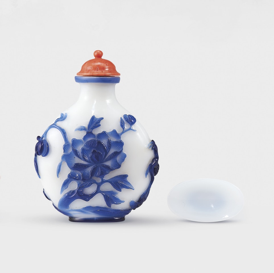 A BLUE-OVERLAY WHITE GLASS ‘PHOENIX AND PEONY’ SNUFF BOTTLE by Anonymous