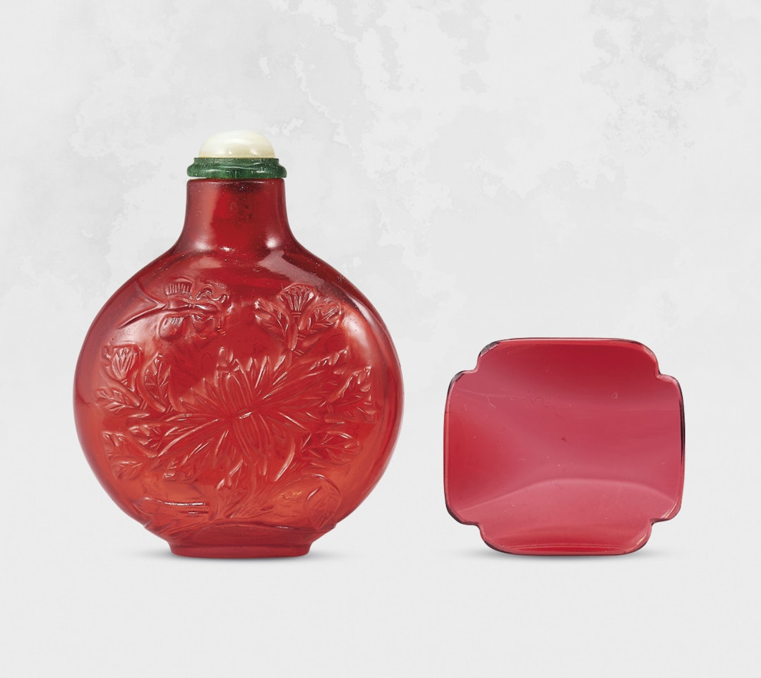 A CARVED RUBY-RED GLASS ‘BUTTERFLY AND PEONY’ SNUFF BOTTLE by Anonymous