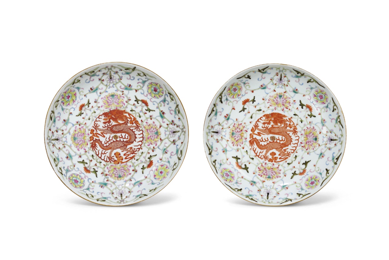 A PAIR OF FAMILLE ROSE AND IRON-RED DECORATED ‘DRAGON’ DISHES by Anonymous