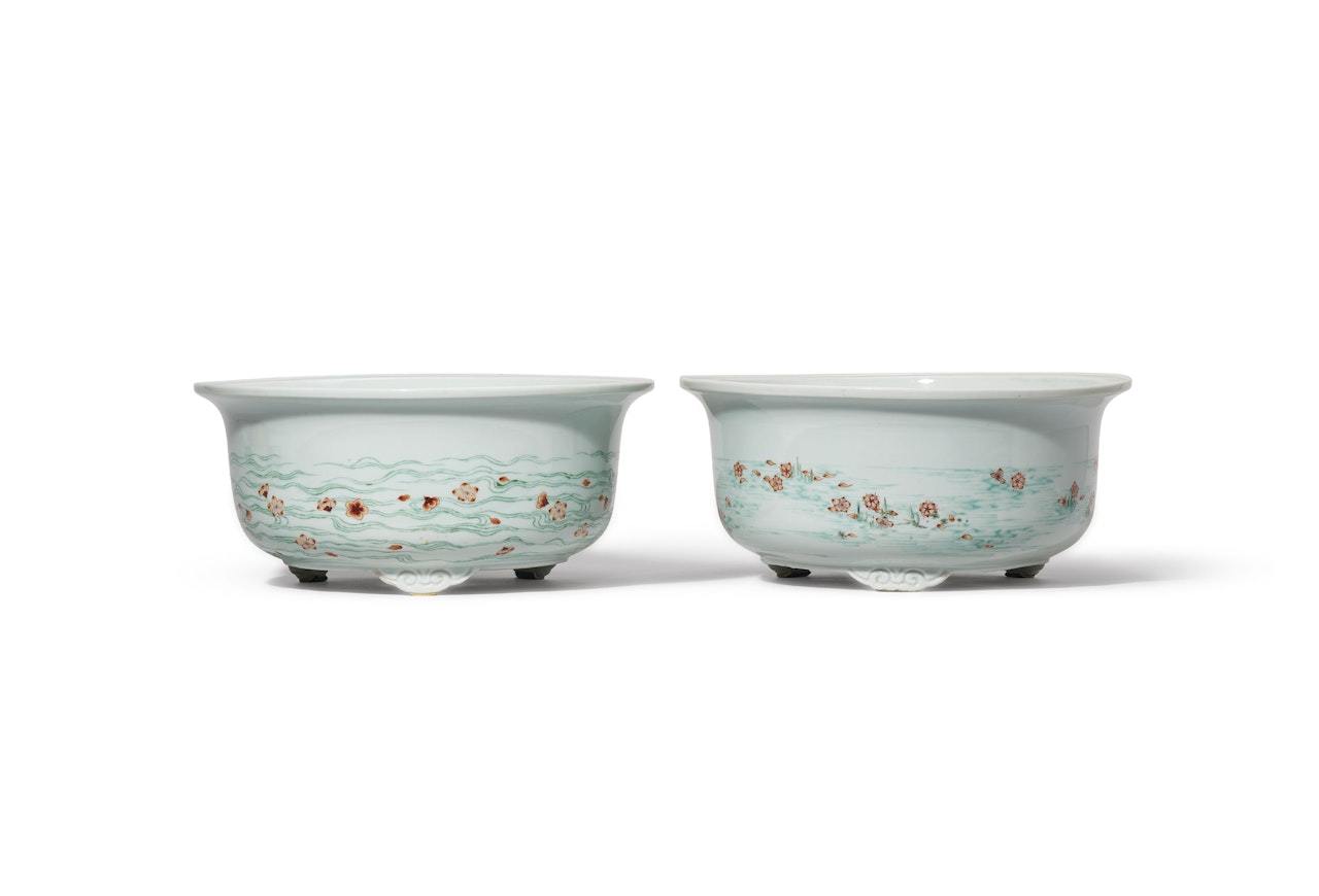 A PAIR OF GREEN ENAMELLED AND IRON RED-DECORATED ‘PEACH BLOSSOM’ JARDINIERES by Anonymous