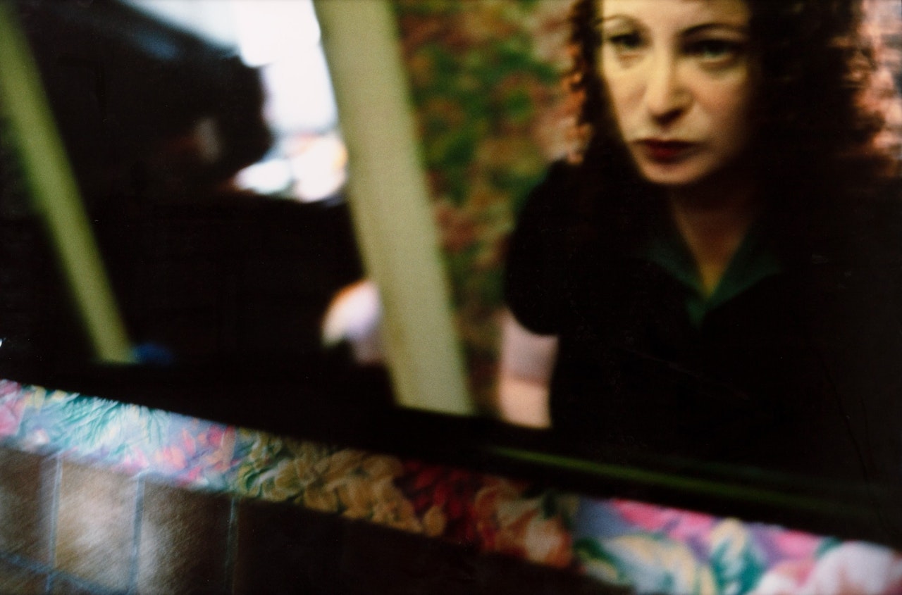 SELF PORTRAIT IN THE HÔTEL DE LA BRETONNERIE by Nan Goldin