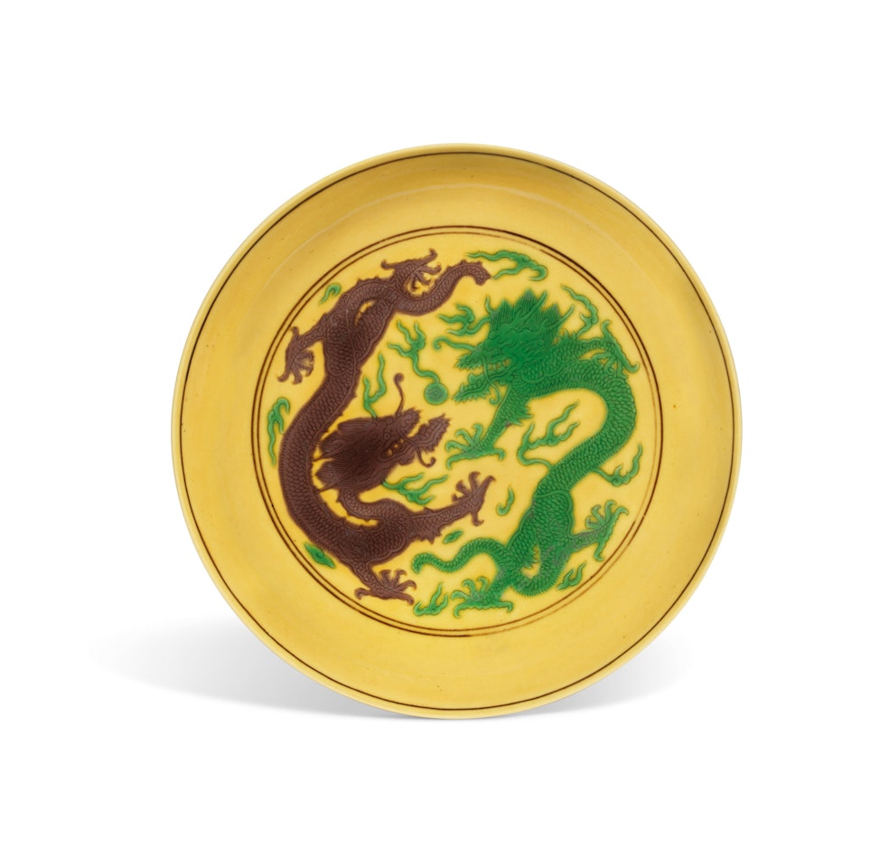 A YELLOW-GROUND GREEN AND AUBERGINE-ENAMELLED 'DRAGON' DISH by Anonymous