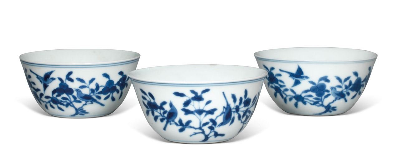 THREE BLUE AND WHITE PORCELAIN ‘BIRD AND FLOWER’ CUPS by Anonymous