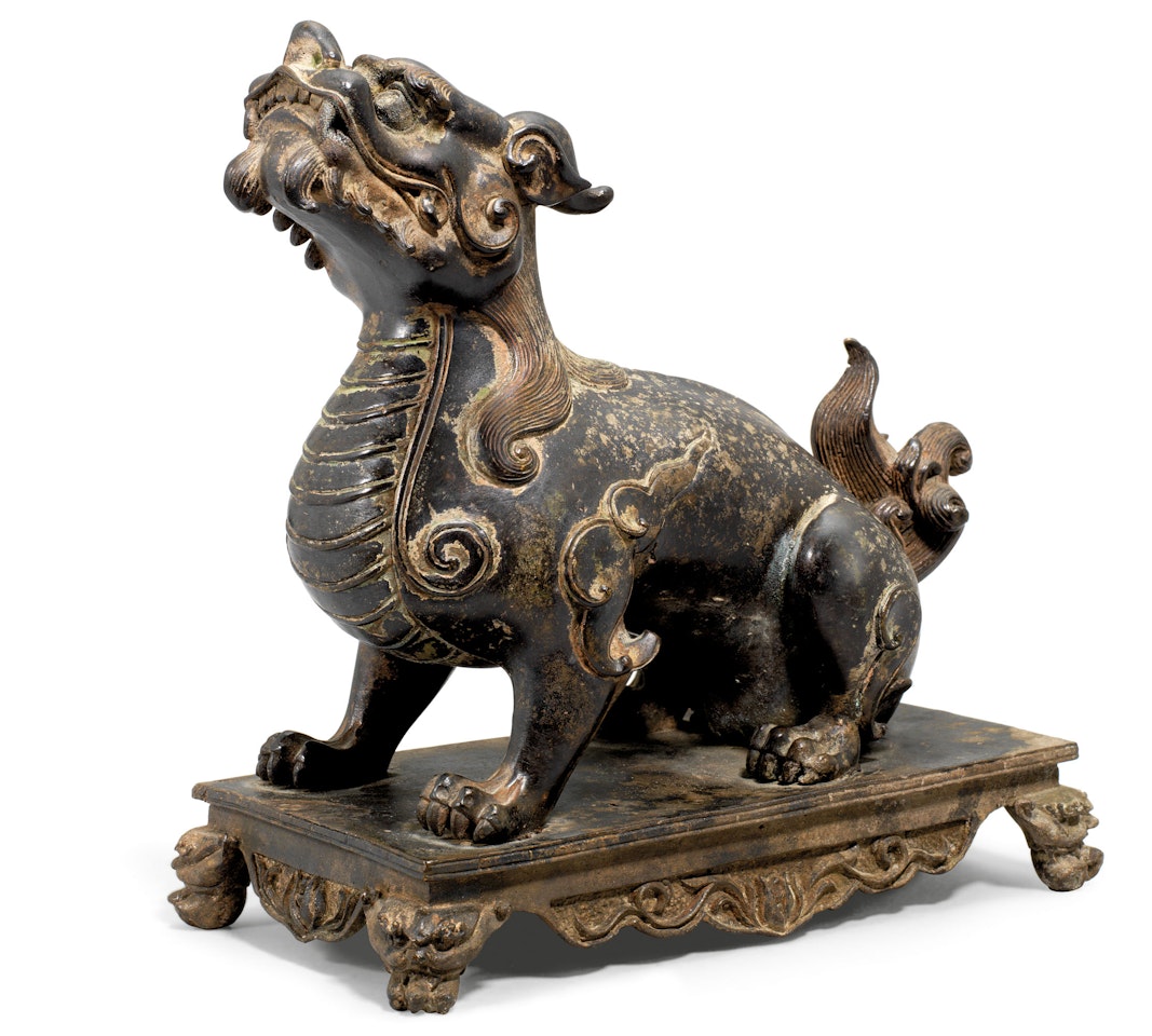 A BRONZE FIGURE OF A QILIN by Anonymous