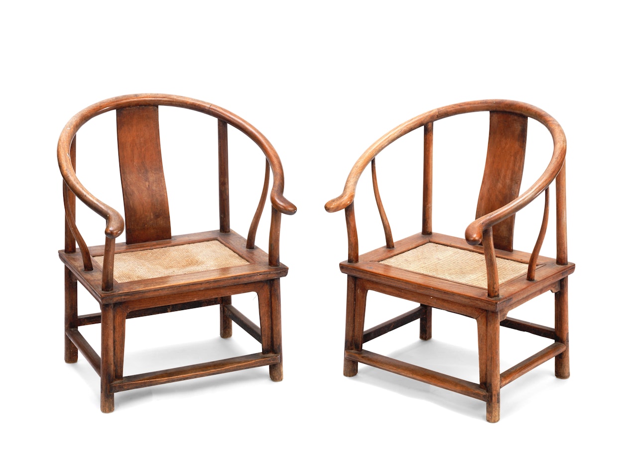 A pair of huanghuali horseshoe-back children's armchairs, quanshiyi by Anonymous