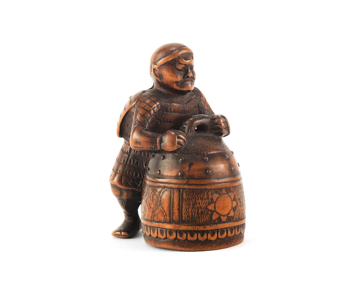 A Wood netsuke of Benkei and the bell of Miidera  by Anonymous