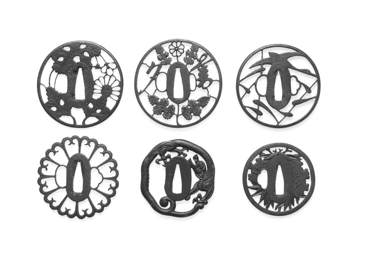 Nine iron sukashi (openwork) tsuba (sword guards) by Anonymous