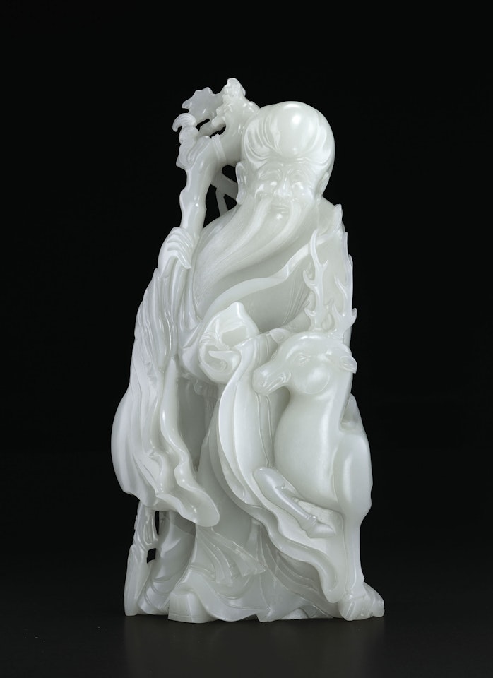 A MAGNIFICENT AND EXCEPTIONALLY RARE LARGE WHITE JADE CARVING OF SHOULAO AND DEER by Anonymous