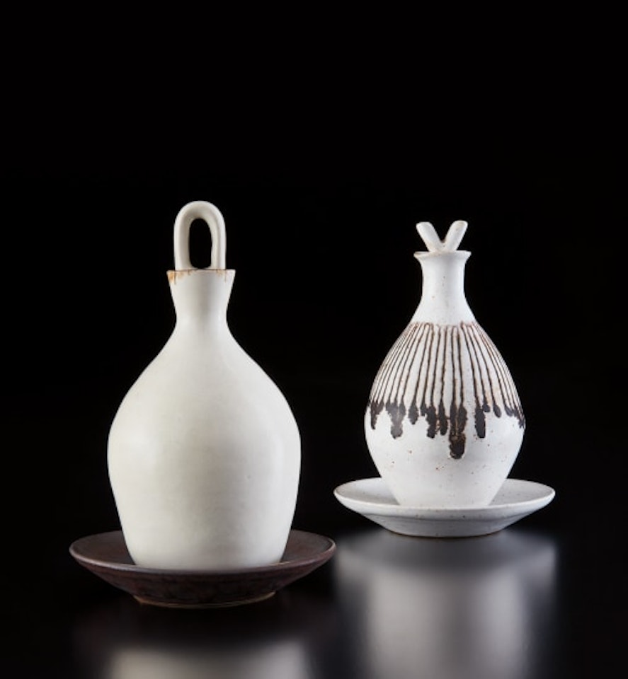 Set of oil and vinegar bottles and saucers by Lucie Rie