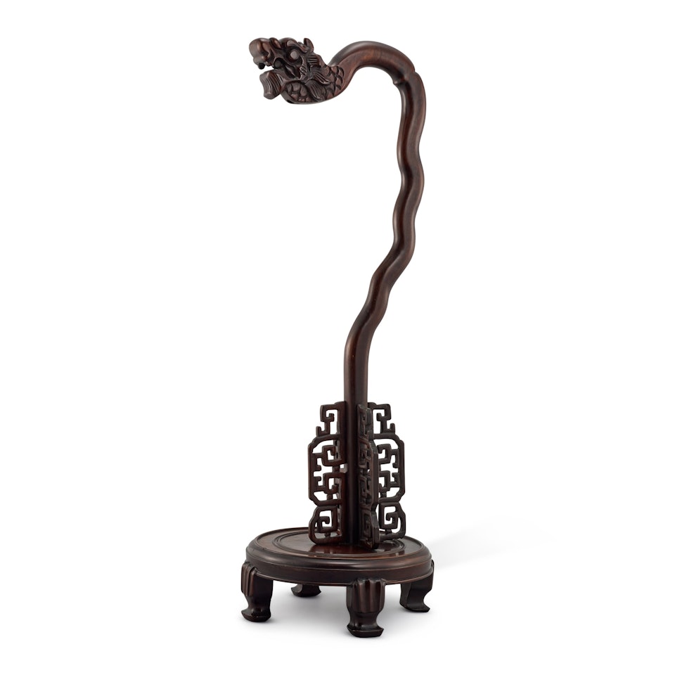 A LARGE HARDWOOD DRAGON-FORM LAMP STAND by Anonymous