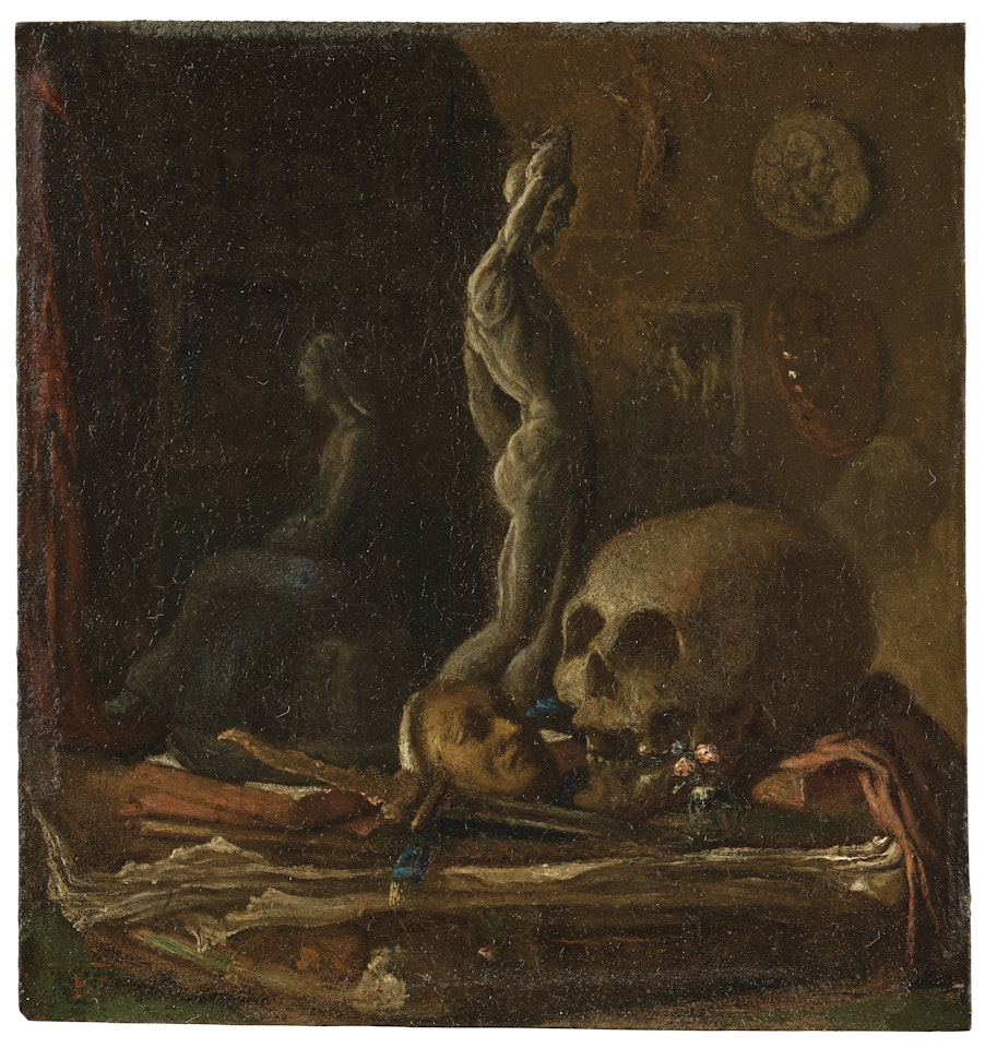 A skull, mask, sword, statuette and book on a table in an artist's studio by French School