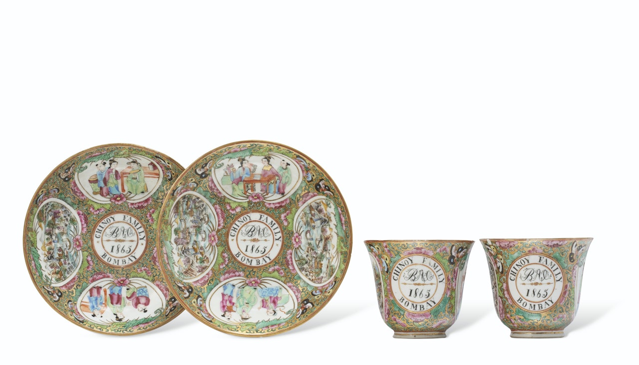 A RARE PAIR OF 'CANTON FAMILLE ROSE' DATED AND INITIALED TEA CUPS AND SAUCERS by Anonymous