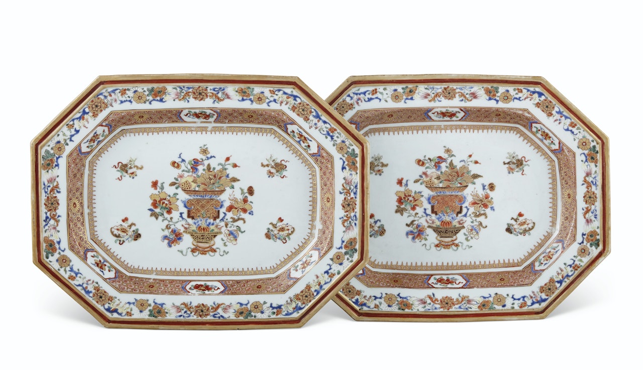 A PAIR OF FAMILLE ROSE AND GILT OCTAGONAL PLATTERS by Anonymous