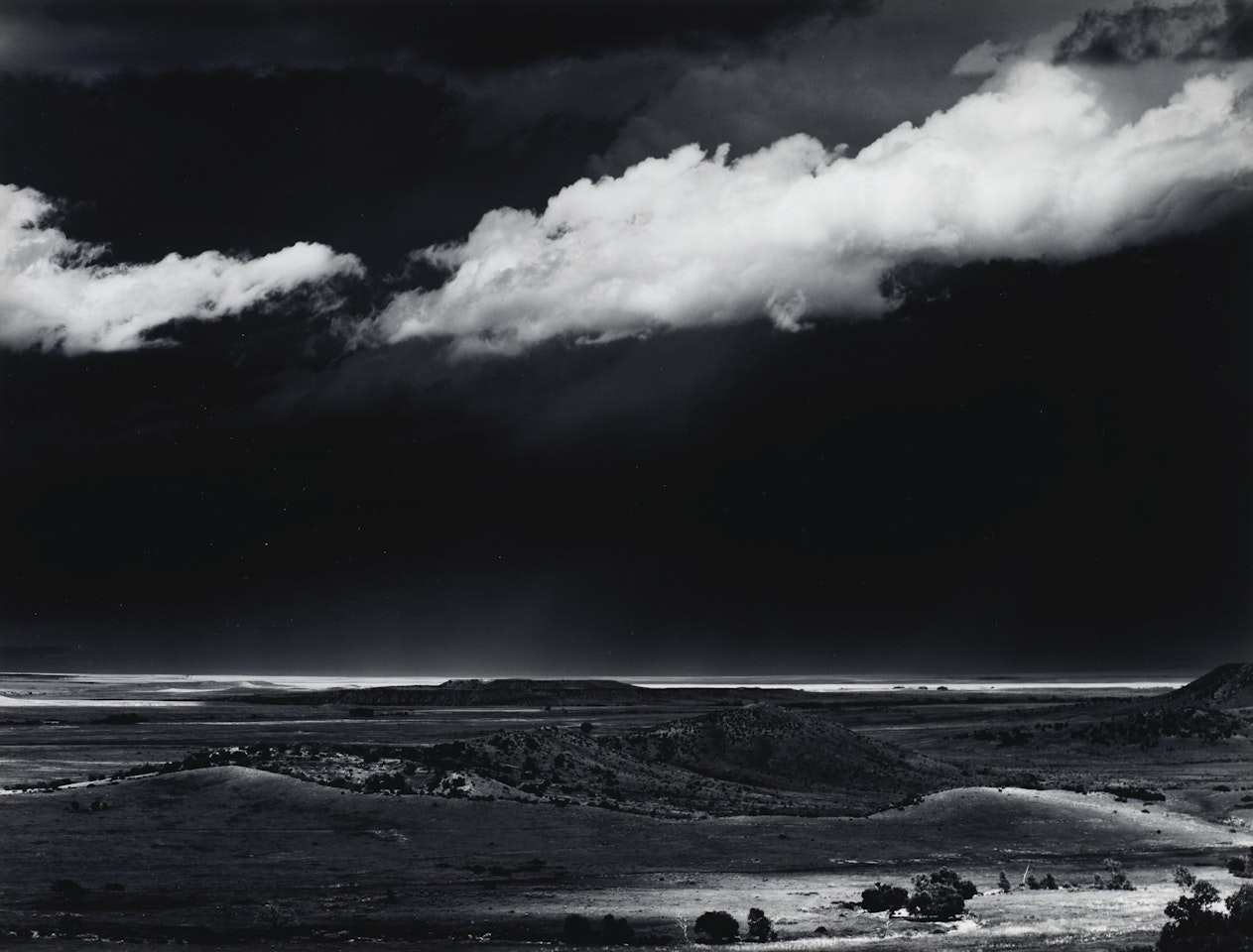 Thunderstorm over the Great Plains near Cimarron, New Mexico, c. 1961 by Ansel Adams