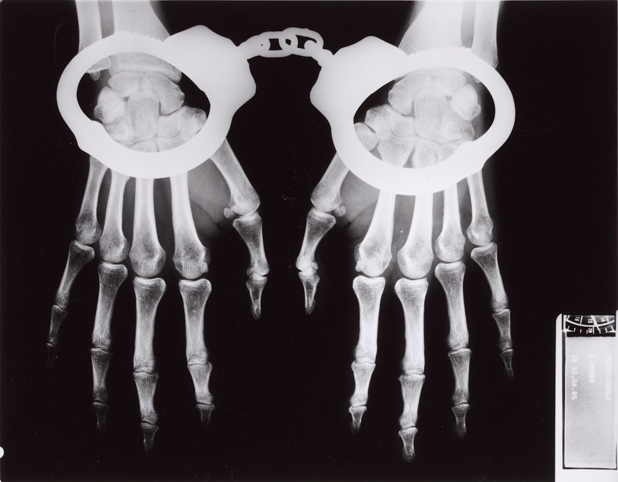 'X-Ray with Handcuffs', French Vogue, Paris, 1994 by Helmut Newton
