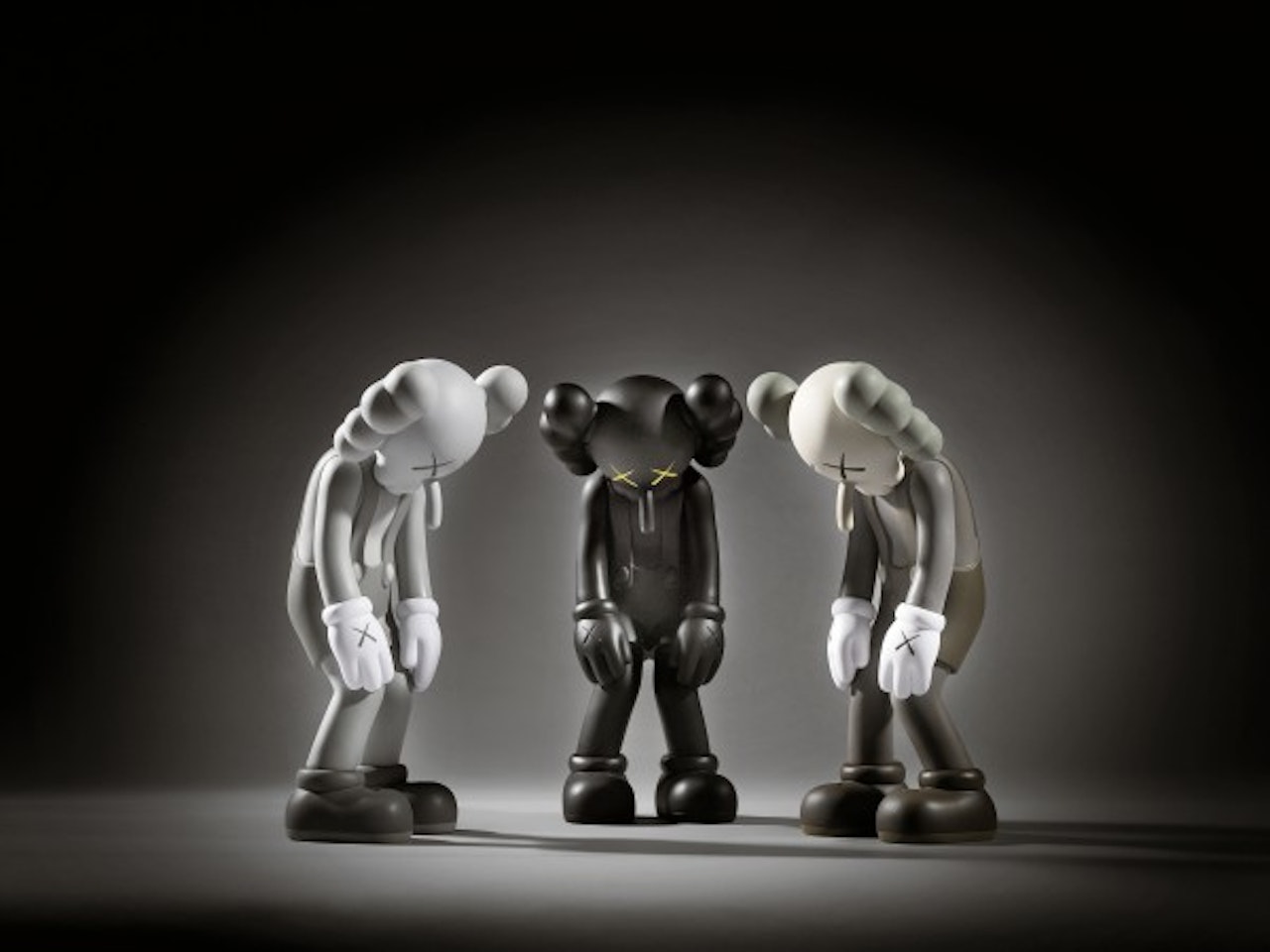 i) small lie (brown) ii) small lie (black) iii) small lie (grey) by Kaws