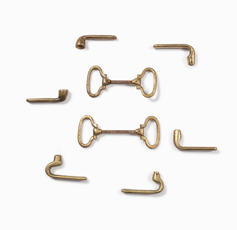 Three pairs of door handles and two pairs of bague door handles by Diego Giacometti