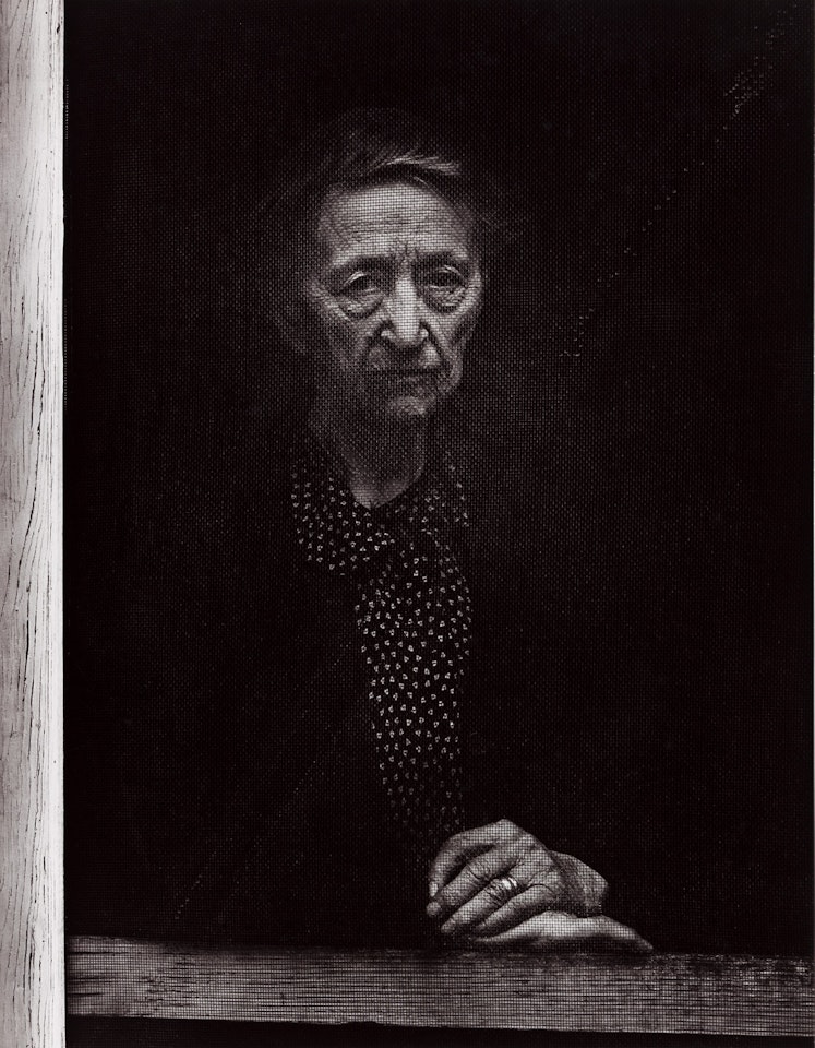 Woman Behind Screen Door, Independence, California by Ansel Adams