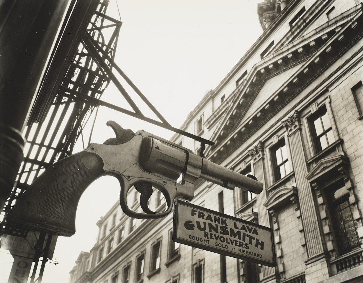 Gunsmith and Police Department, 6 Center Market Place, Manhattan by Berenice Abbott