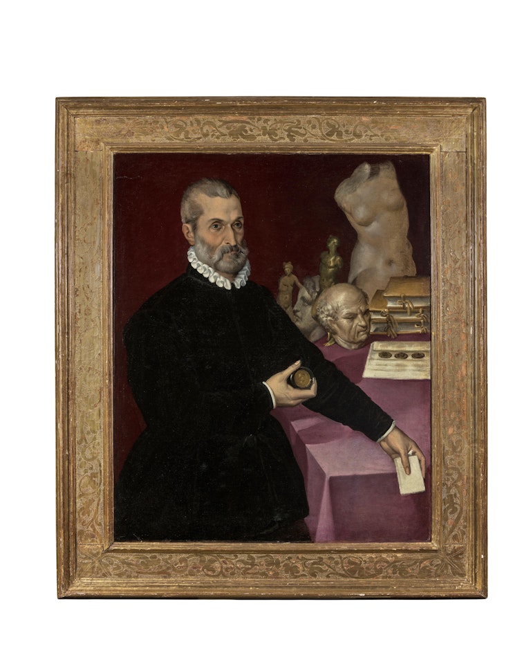 Portrait of a Collector, standing three-quarter-length, before a draped table with statues, medallions and books by Bartolomeo Passarotti