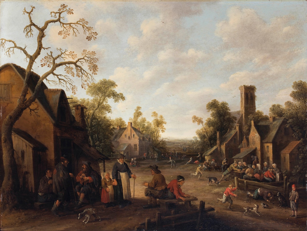 A village square with people eating outside an inn, and children playing with dogs by Joost Cornelisz Droochsloot